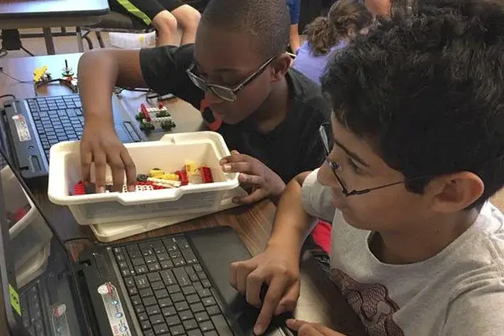 Middle school students participating in science education programs